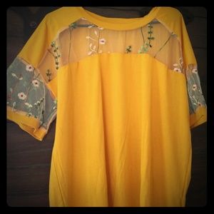 Yellow blouse with sheer openings